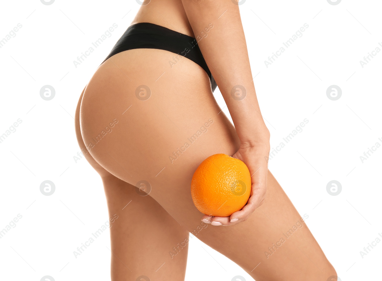 Photo of Closeup view of slim woman in underwear with orange on white background. Cellulite problem concept