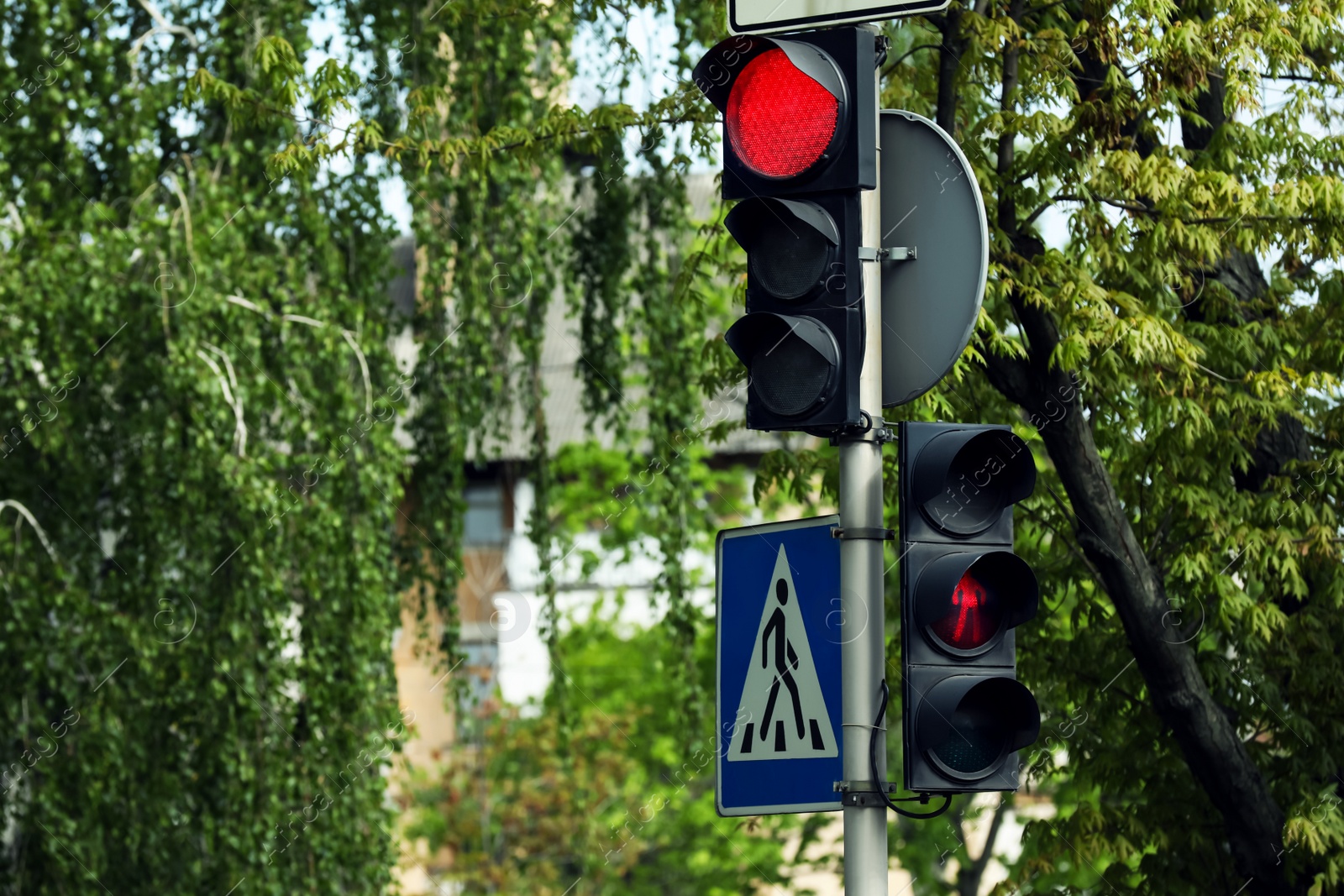 Photo of View of modern traffic lights on city street