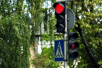 Photo of View of modern traffic lights on city street
