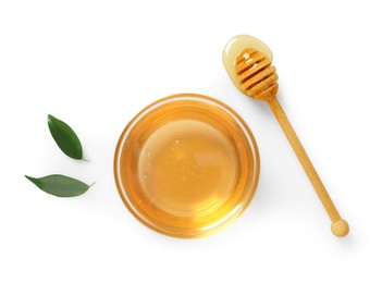 Tasty honey in bowl, dipper and green leaves on white background, flat lay