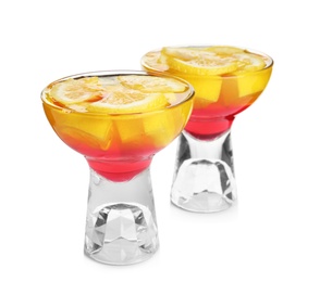 Photo of Tasty jelly desserts with slices of lemon in glasses on white background