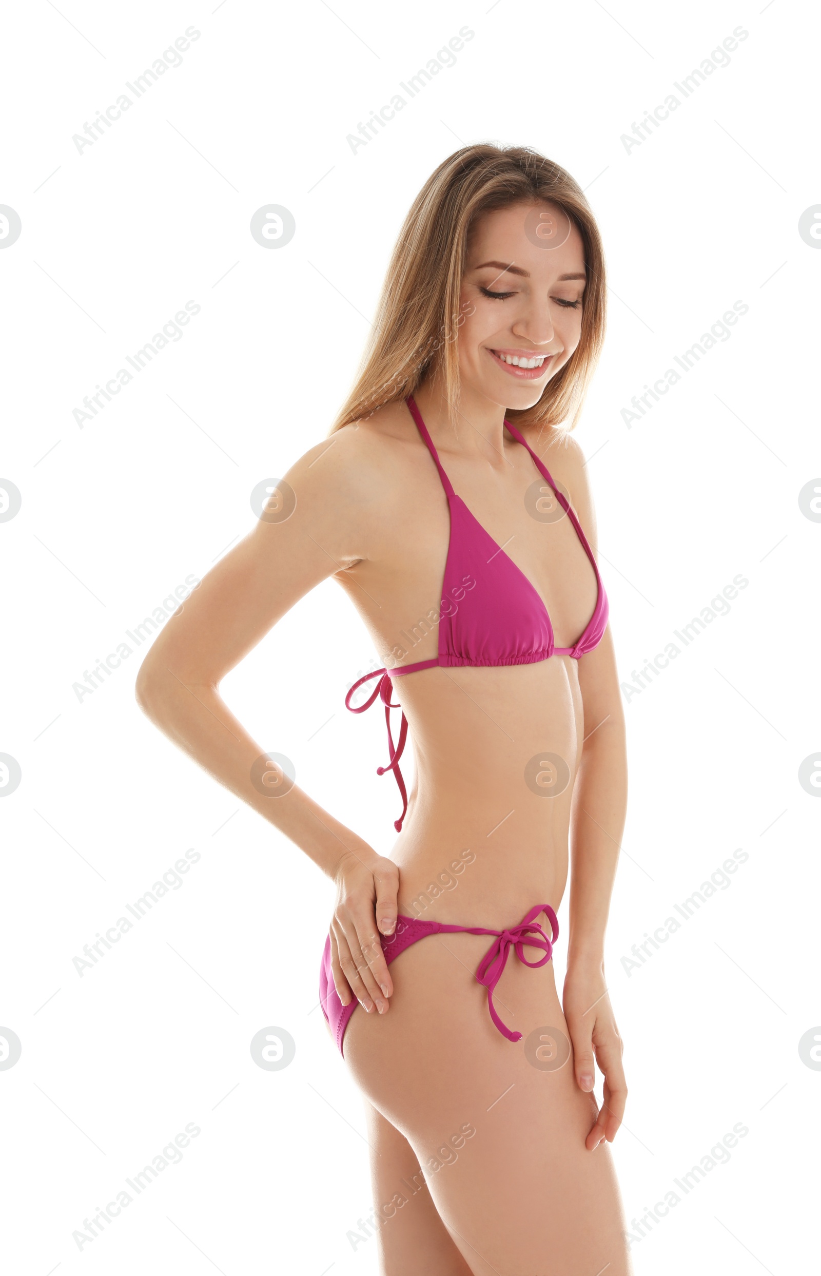 Photo of Young slim woman in bikini on white background. Perfect body