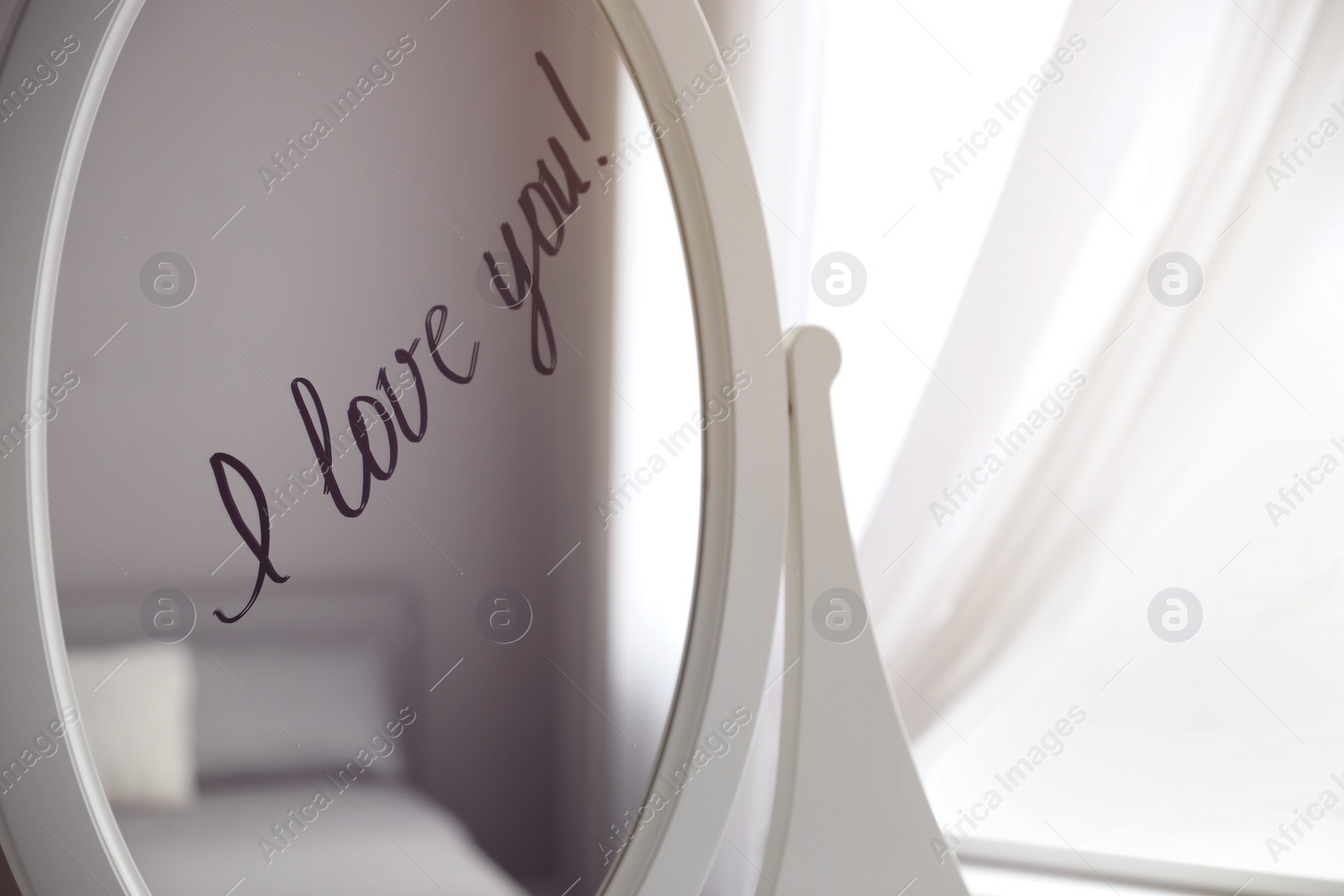 Photo of Words I Love You written on mirror indoors