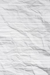 Sheet of crumpled lined paper as background, top view