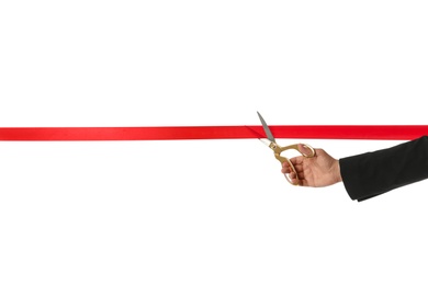 Photo of Man in office suit cutting red ribbon isolated on white, closeup