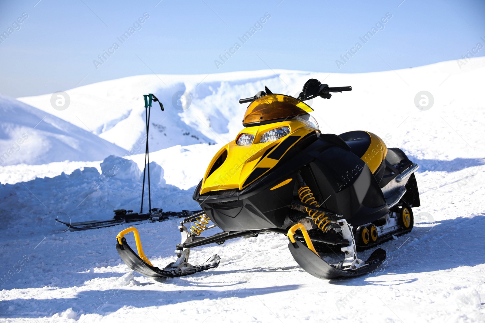 Photo of Modern snowmobile at ski resort. Winter vacation