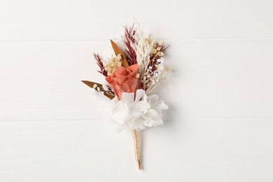Photo of Beautiful boutonniere on white background, top view
