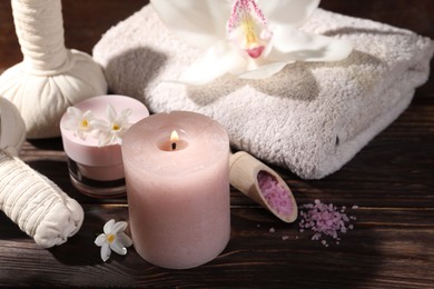 Composition with spa supplies and flowers on wooden table