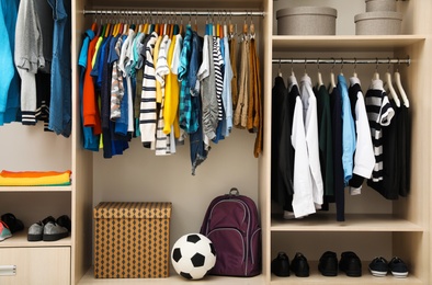 Photo of Large wardrobe with teenager clothes, shoes and accessories