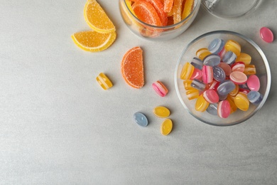 Tasty sweets on light grey table, flat lay. Space for text