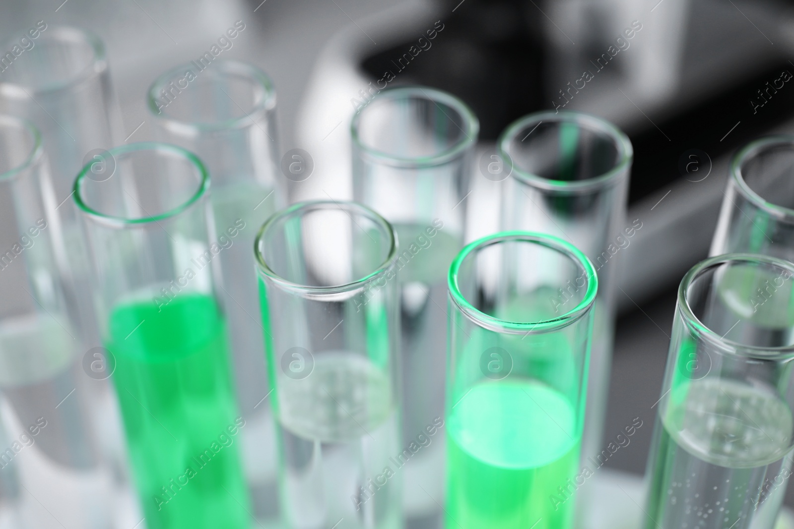 Photo of Closeup view of laboratory test tubes with reagents. Solution chemistry