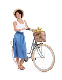 Portrait of beautiful young woman with bicycle on white background