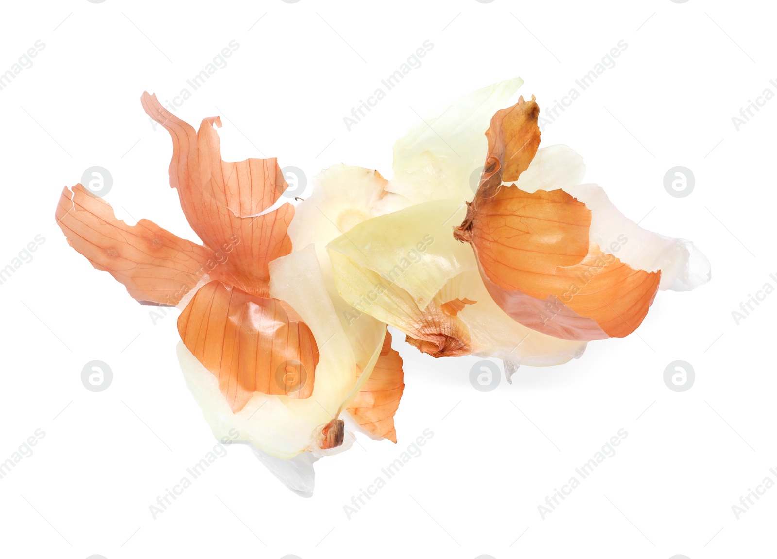 Photo of Peels of fresh onion isolated on white, above view