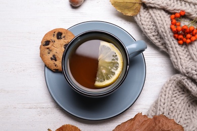 Photo of Flat lay composition with hot drink on white wooden background. Cozy autumn