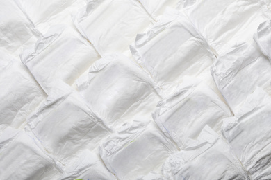 Photo of Baby diapers as background, top view. Child's garment