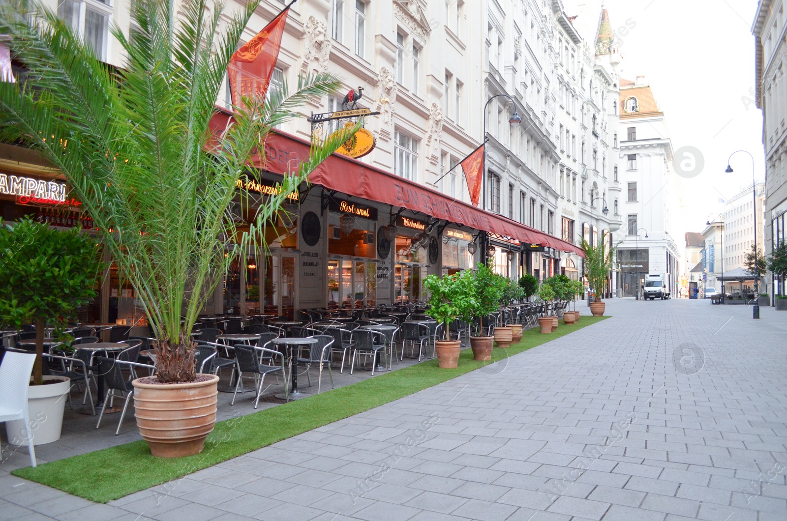 Photo of VIENNA, AUSTRIA - JUNE 18, 2018: Open-air restaurant on city street