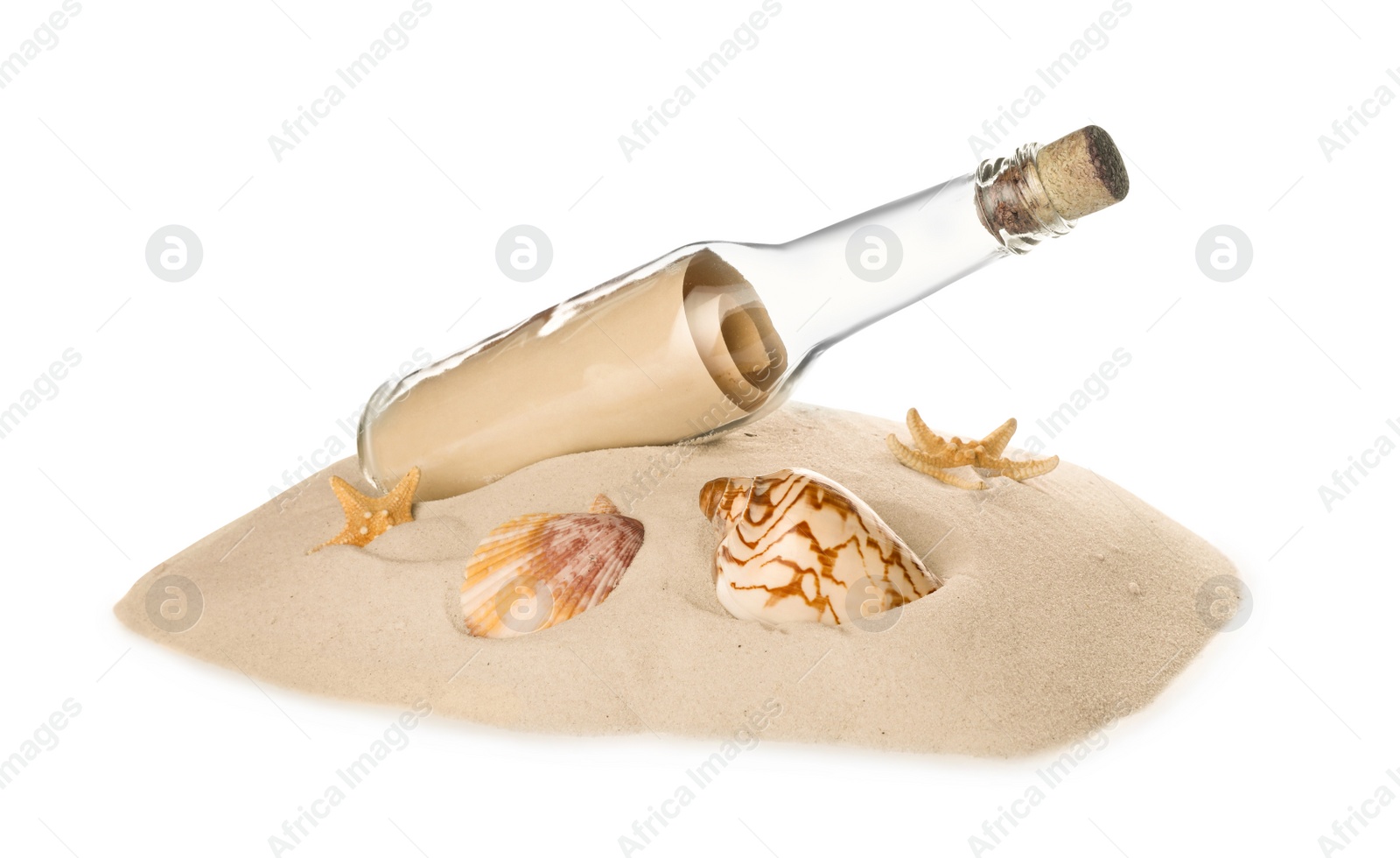 Photo of Corked glass bottle with rolled paper note and seashells on sand against white background