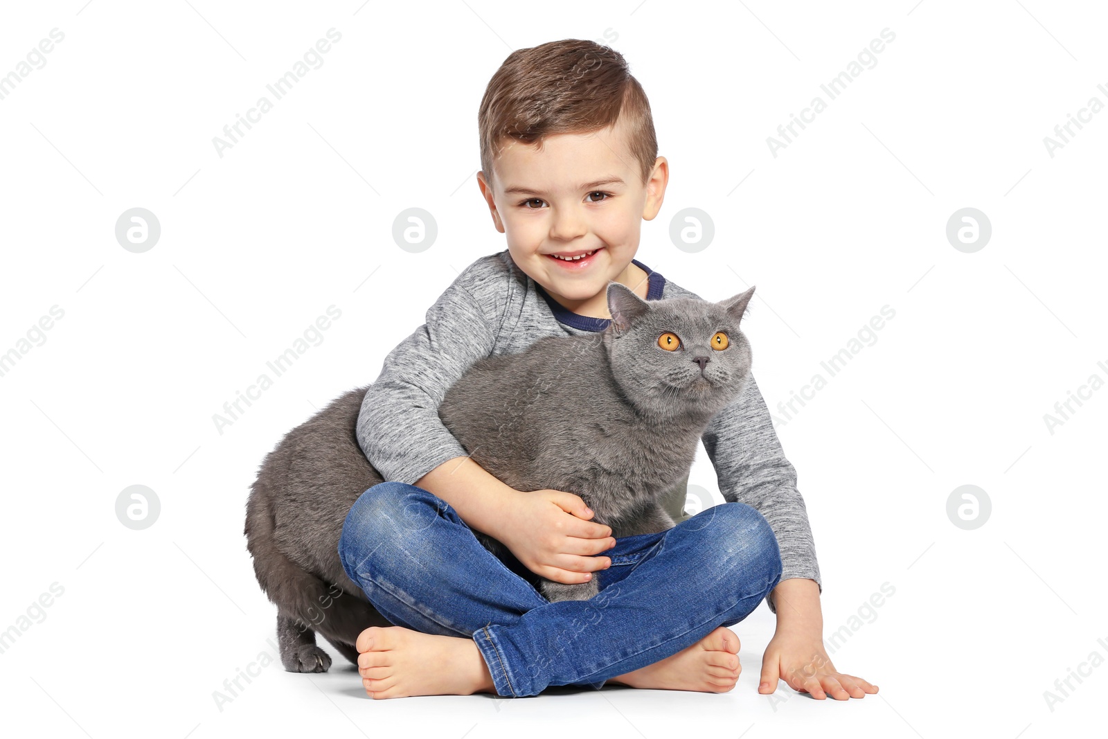 Photo of Cute little child with cat on white background