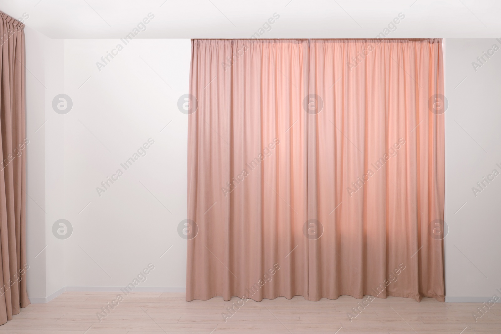 Photo of Elegant window curtains in room. Interior design
