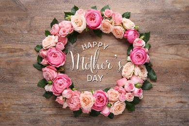 Image of Happy Mother's Day. Greeting card with frame of beautiful roses on wooden background, flat lay