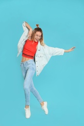 Photo of Full length portrait of emotional woman dancing on color background