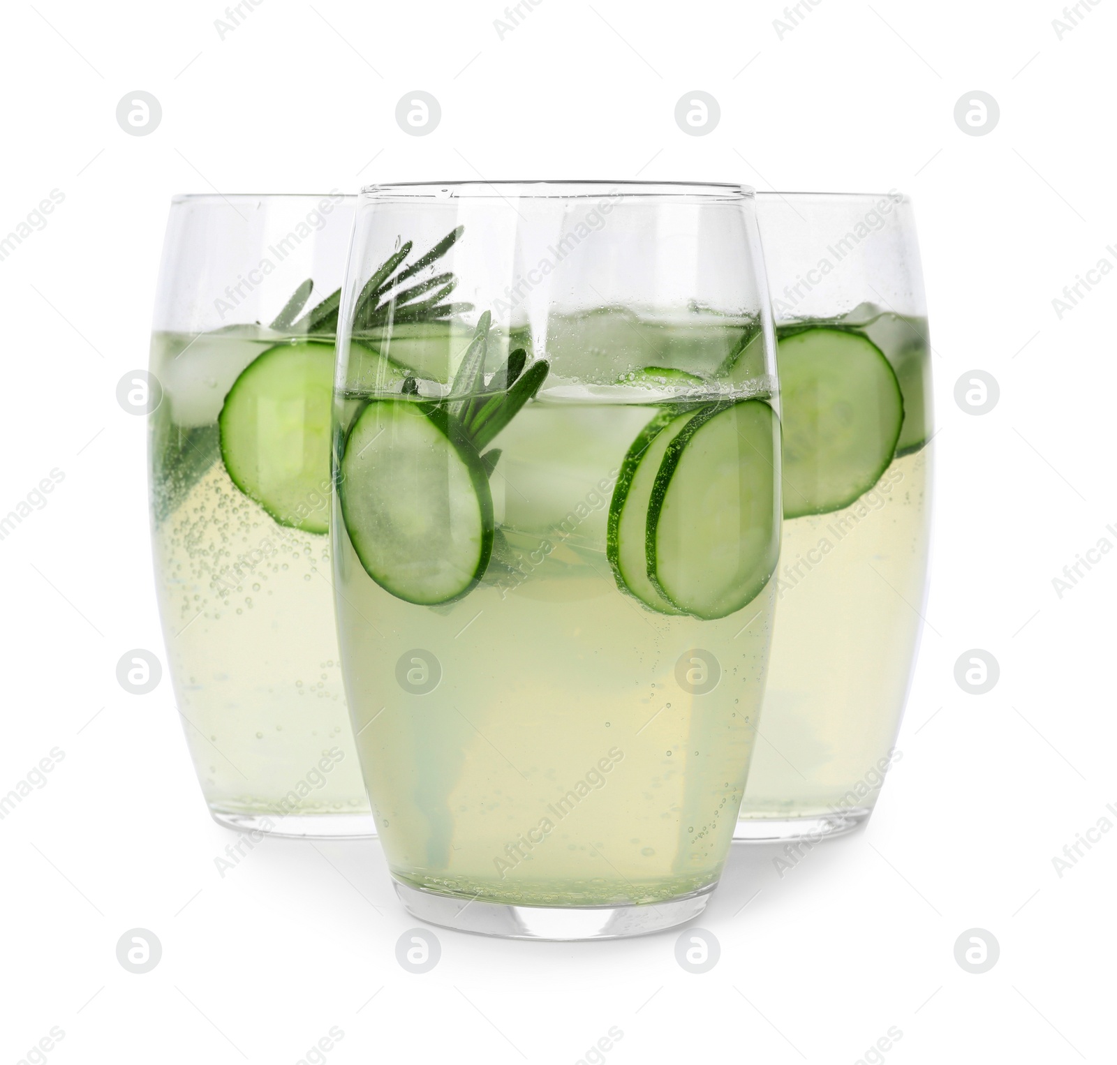 Photo of Glasses of refreshing cucumber lemonade and rosemary on white background. Summer drink