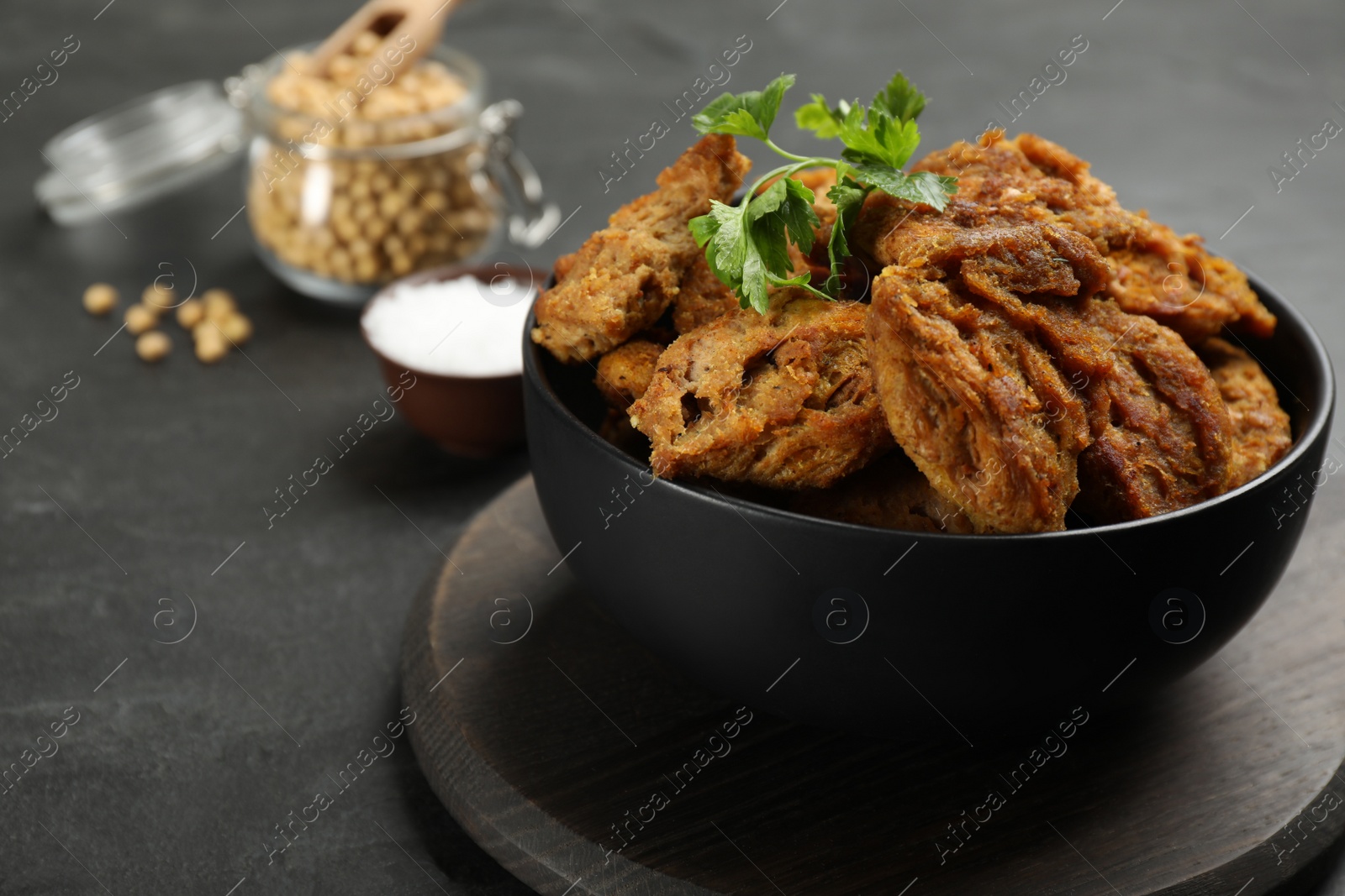 Photo of Cooked soy meat on black slate table, closeup