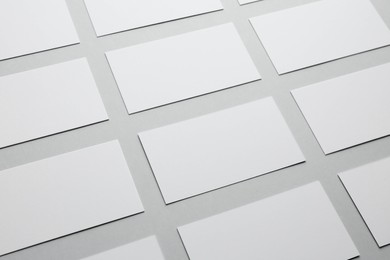 Photo of Blank business cards on light gray background, closeup. Mockup for design