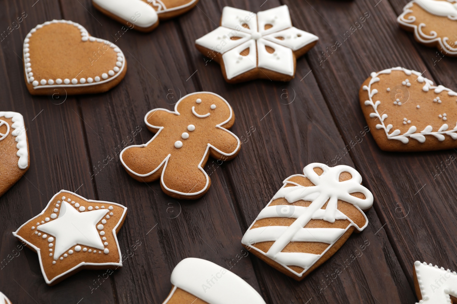 Photo of Many different delicious Christmas cookies on wooden table