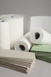 Photo of Paper towels and napkins on grey background