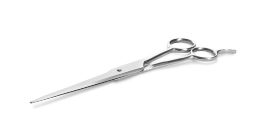 Pair of sharp hairdresser's scissors on white background