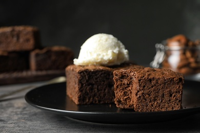 Photo of Fresh brownies served with ice-cream on table, space for text. Delicious chocolate pie