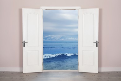 Sea with rolling waves visible through open door