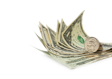 Dollar banknotes and coins on white background, closeup