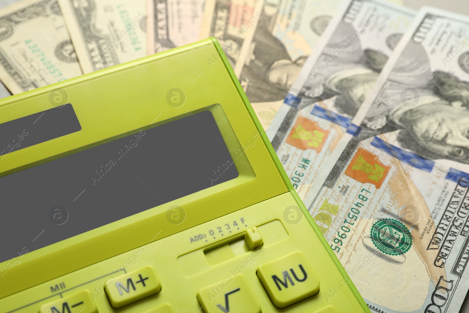 Photo of Calculator and money, closeup view. Tax accounting