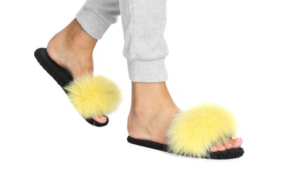 Photo of Woman in fluffy slippers on white background, closeup