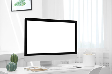 Photo of Comfortable workplace with modern computer on table