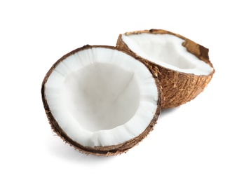 Halves of coconut on white background