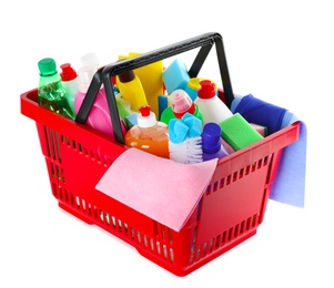 Shopping basket with different detergents and rag on white background