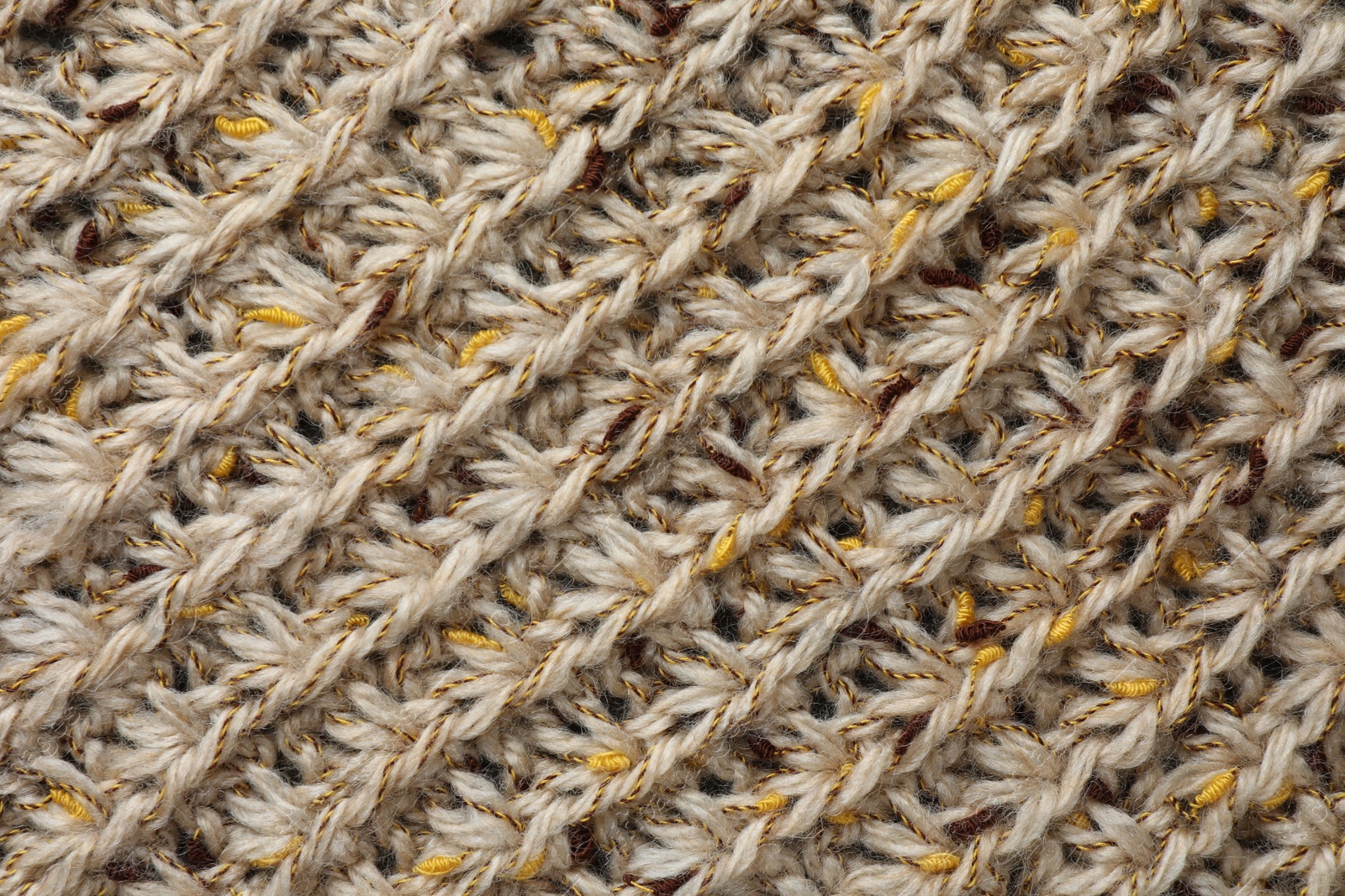 Photo of Texture of knitted fabric as background, top view