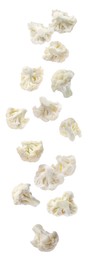 Image of Many fresh cauliflower florets falling on white background