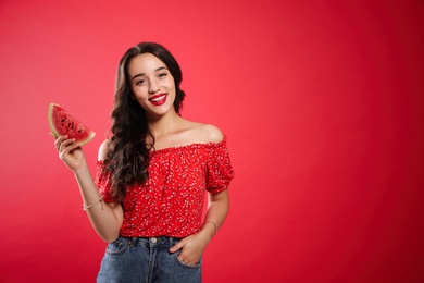 Photo of Beautiful young woman with watermelon on red background. Space for text