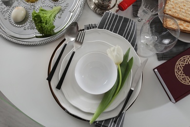 Festive Passover table setting with Torah, top view. Pesach celebration