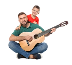 Father playing guitar for his son on white background