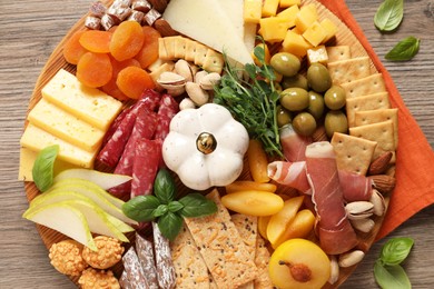 Different tasty appetizers on wooden table, top view