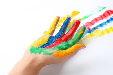 Child with painted palm on white background, closeup