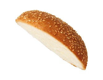 Photo of Half of fresh burger bun with sesame seeds isolated on white