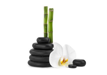 Photo of Stack of spa stones, beautiful orchid flower and bamboo stems on white background