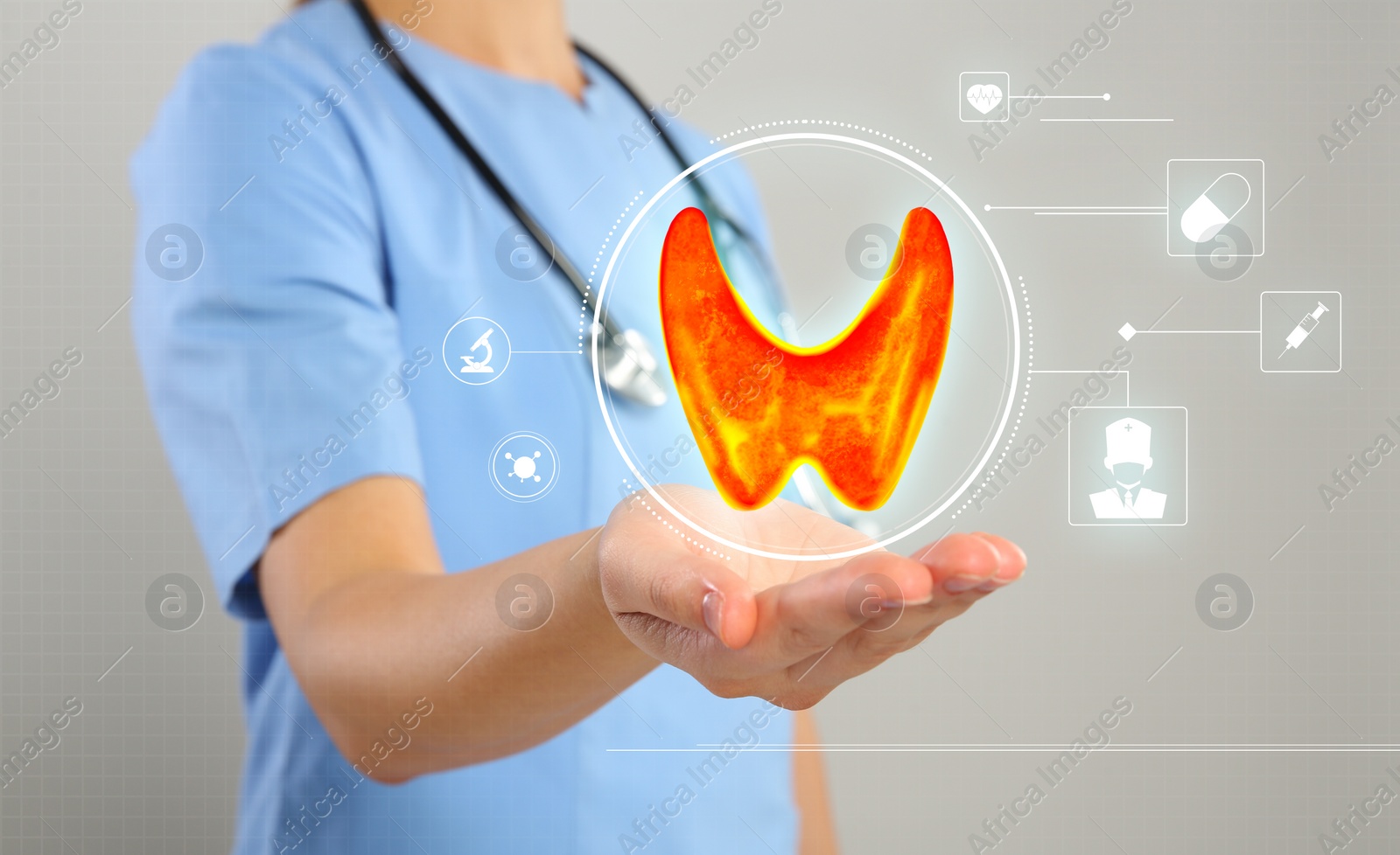 Image of Diagnosis and treatment of thyroid diseases. Endocrinologist holding virtual scheme with unhealthy gland and icons on light grey background, closeup