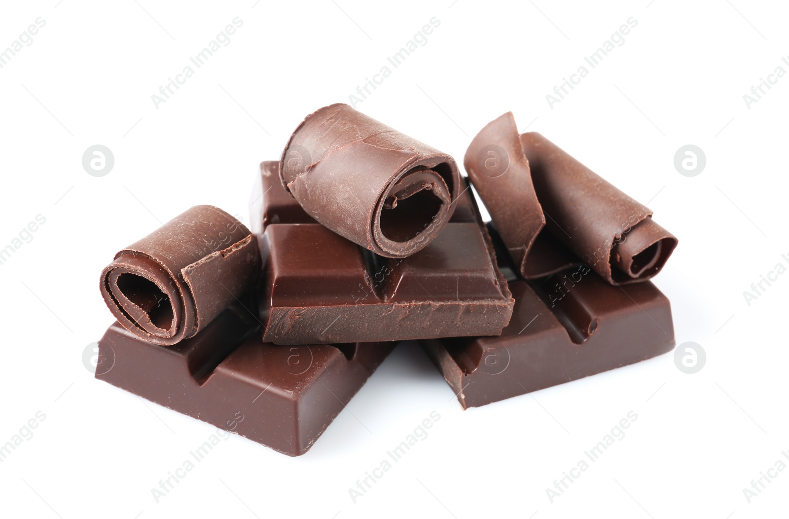 Photo of Yummy chocolate curls and pieces on white background